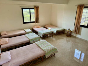 Shared Bedroom in the accommodation in Gram Gaurav Pratishthan Ayurveda massage training course Ayurvedic massage training courses in Pune
